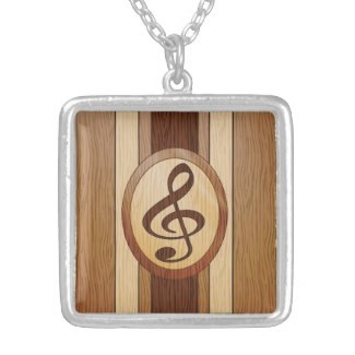 Faux wood inlay treble clef necklace
