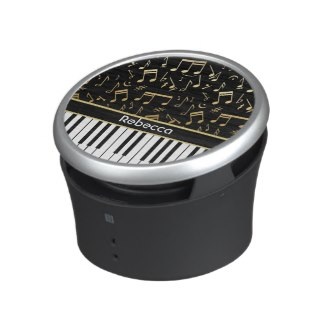 Golden musical notes and piano keys bluetooth speaker